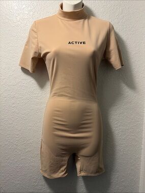 ACTIVE Short Sleeve Mock Neck Romper in Nude